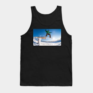 Snowboarder jumping against blue sky Tank Top